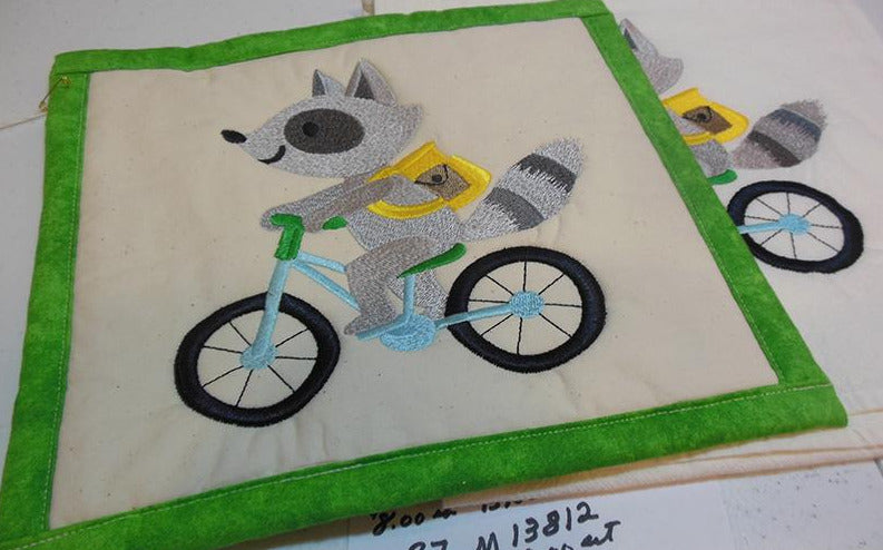 Raccoon on Bike Towel & Potholder Set